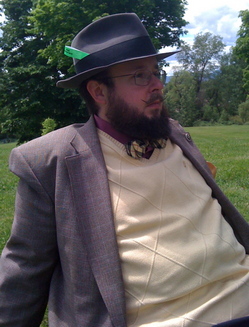 Erik reclines in a park.